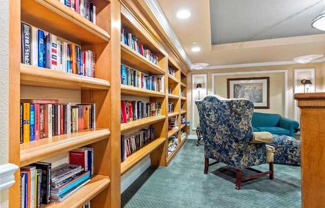 sitting room featuring bookshelves, carpet flooring, and recessed lighting