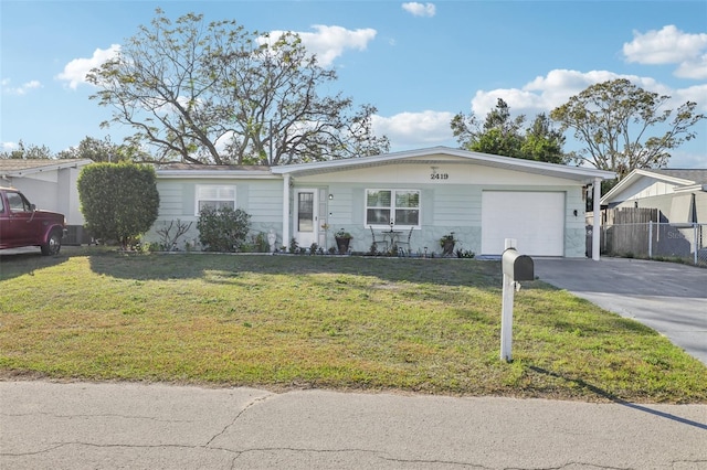 ranch-style home featuring a garage and a front lawn