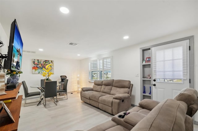 2419 Palmwood Dr, Holiday, FL 34690 - living room with light wood-type flooring