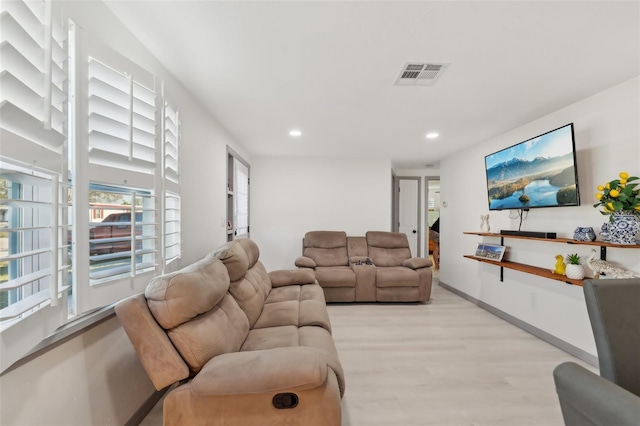 2419 Palmwood Dr, Holiday, FL 34690 - living room featuring light hardwood / wood-style floors