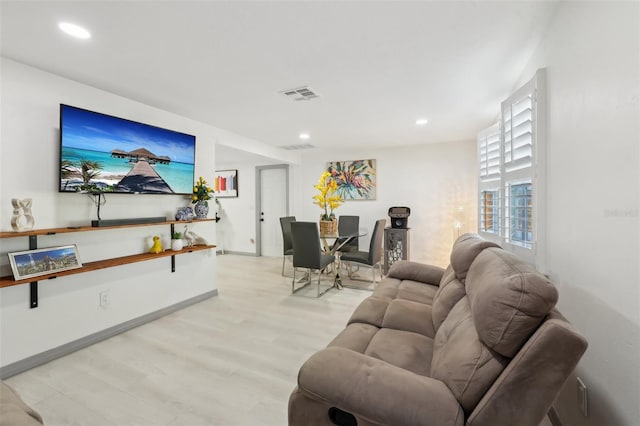 2419 Palmwood Dr, Holiday, FL 34690 - living room featuring light hardwood / wood-style flooring