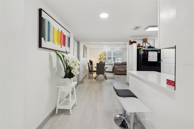 2419 Palmwood Dr, Holiday, FL 34690 - hall featuring light hardwood / wood-style floors
