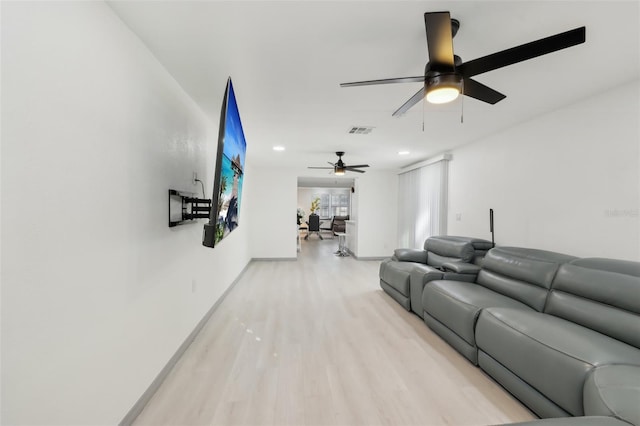 2419 Palmwood Dr, Holiday, FL 34690 - living room featuring ceiling fan and light hardwood / wood-style floors