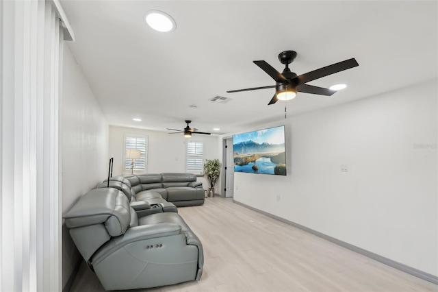 2419 Palmwood Dr, Holiday, FL 34690 - living room featuring ceiling fan and light hardwood / wood-style flooring