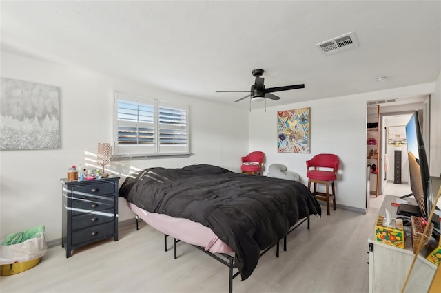 2419 Palmwood Dr, Holiday, FL 34690 - bedroom featuring ceiling fan and light hardwood / wood-style flooring
