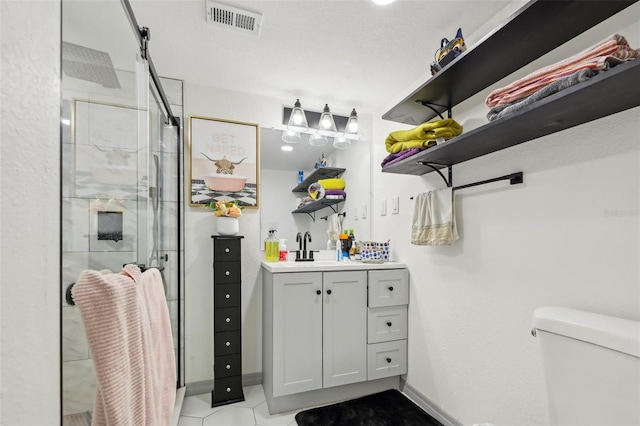 2419 Palmwood Dr, Holiday, FL 34690 - bathroom featuring vanity, toilet, and a shower with shower door