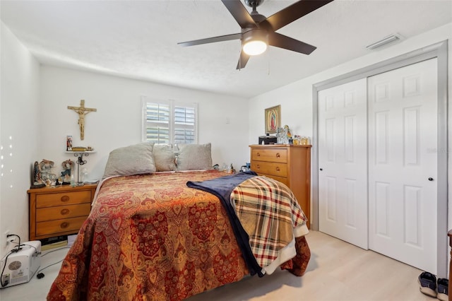 2419 Palmwood Dr, Holiday, FL 34690 - bedroom featuring ceiling fan, light hardwood / wood-style floors, and a closet