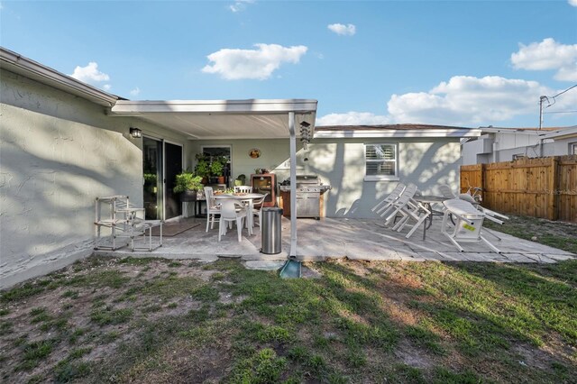 2419 Palmwood Dr, Holiday, FL 34690 - back of house with a yard and a patio area