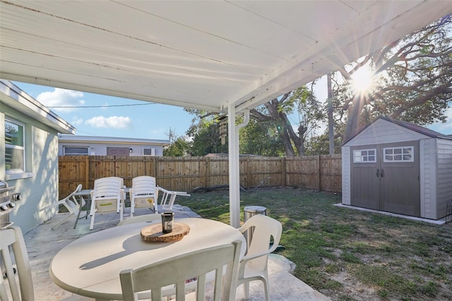 2419 Palmwood Dr, Holiday, FL 34690 - view of patio / terrace featuring a storage unit
