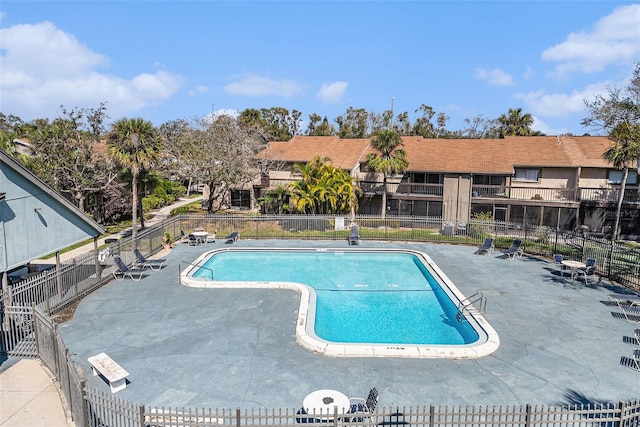 6308 Newtown Cir Unit 8C5, Tampa, FL 33615 - pool with a patio and fence