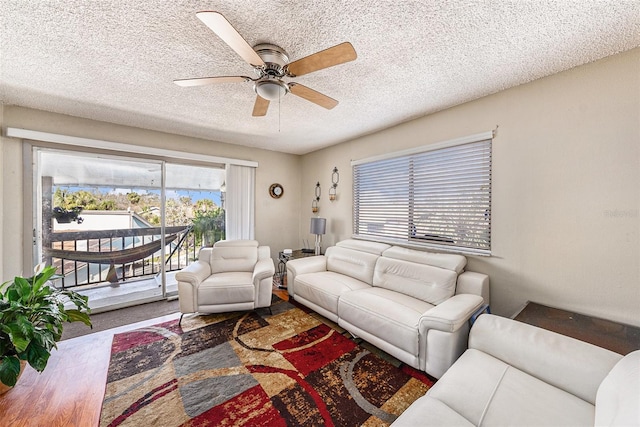 6308 Newtown Cir Unit 8C5, Tampa, FL 33615 - living area with a textured ceiling and ceiling fan