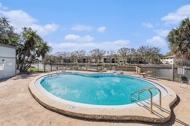 6308 Newtown Cir Unit 8C5, Tampa, FL 33615 - community pool featuring a patio area and fence