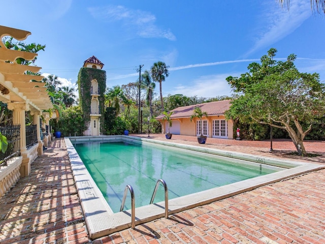 pool featuring a patio area