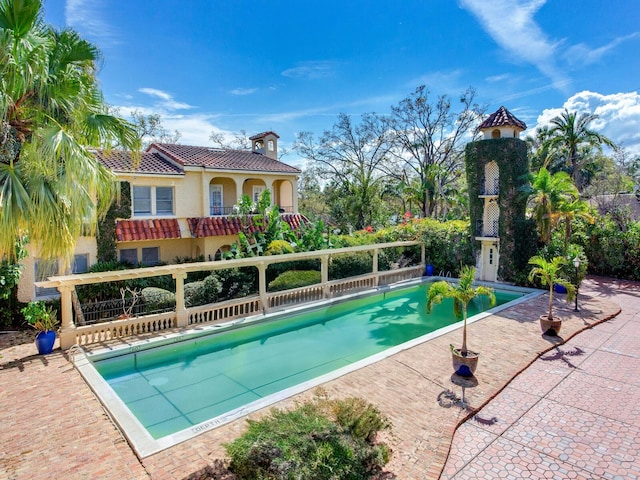 view of swimming pool featuring a fenced in pool