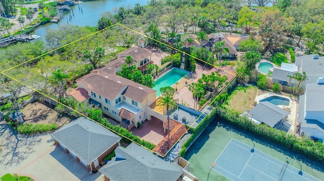 drone / aerial view with a residential view and a water view