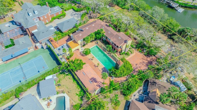 birds eye view of property with a residential view and a water view