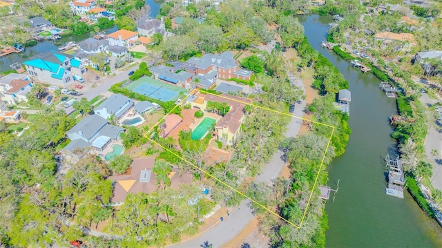 bird's eye view with a residential view and a water view