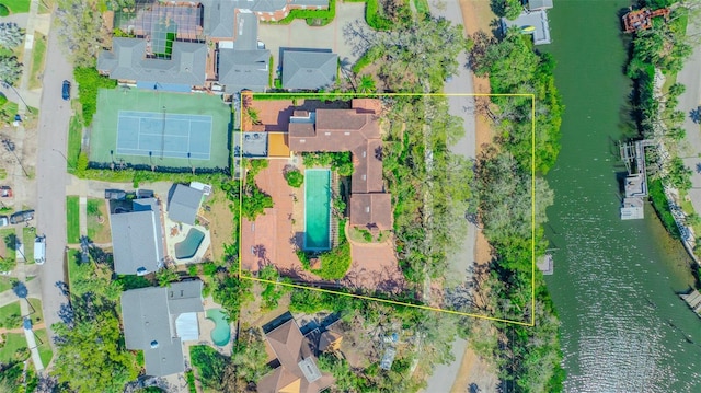 birds eye view of property with a residential view and a water view