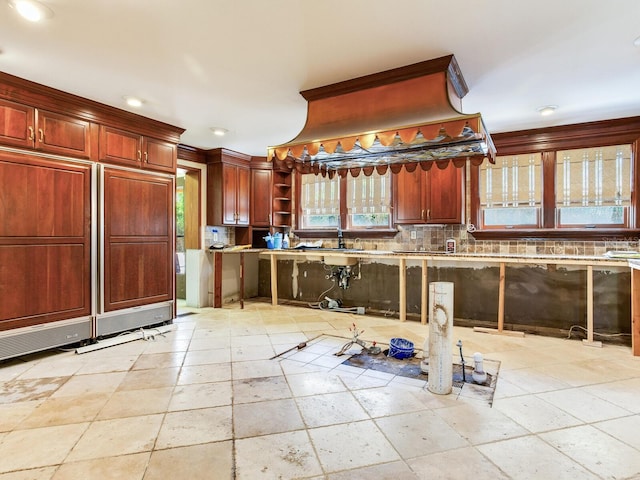 5020 S Shore Crest Cir, Tampa, FL 33609 - kitchen with reddish brown cabinets, decorative backsplash, built in fridge, and open shelves