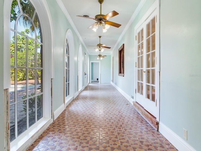 5020 S Shore Crest Cir, Tampa, FL 33609 - hallway with baseboards, ornamental molding, and tile patterned floors
