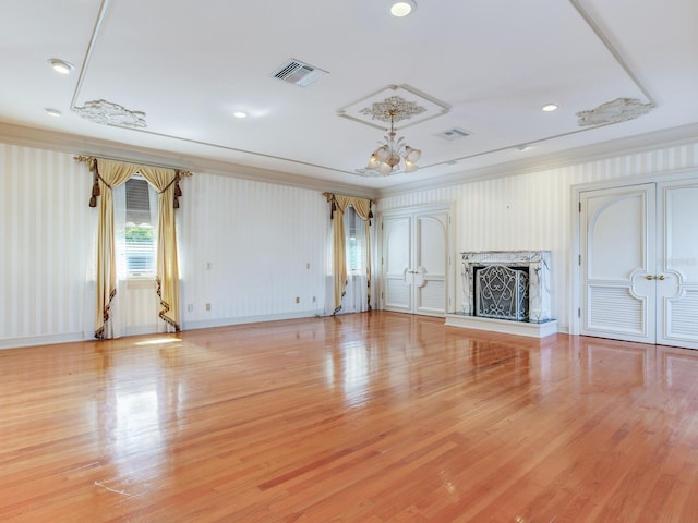 5020 S Shore Crest Cir, Tampa, FL 33609 - unfurnished living room with baseboards, visible vents, an inviting chandelier, and light wood finished floors