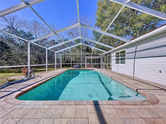 8600 Berkley Dr, Hudson, FL 34667 - view of swimming pool with a patio and glass enclosure