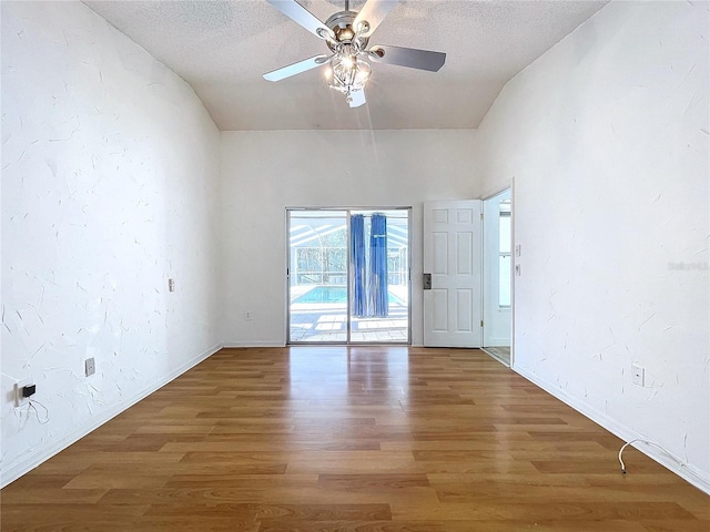 8600 Berkley Dr, Hudson, FL 34667 - unfurnished room featuring hardwood / wood-style flooring, ceiling fan, and a textured ceiling