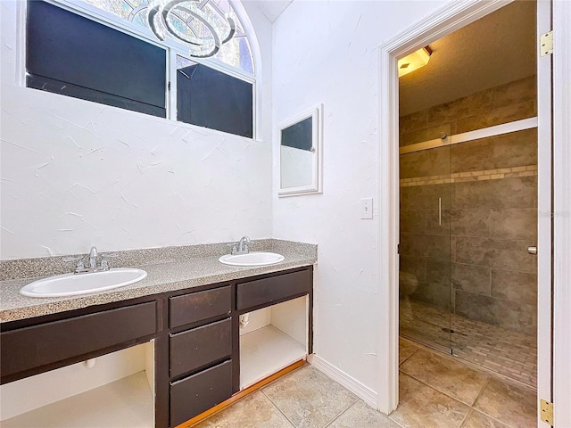 8600 Berkley Dr, Hudson, FL 34667 - bathroom featuring tile patterned flooring, vanity, and an enclosed shower