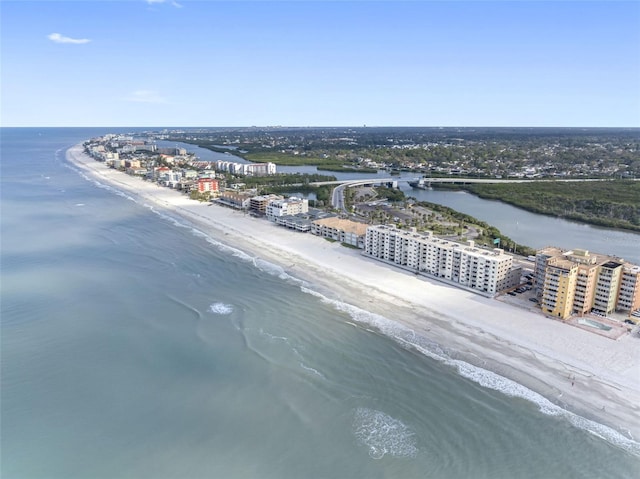 bird's eye view with a water view and a beach view