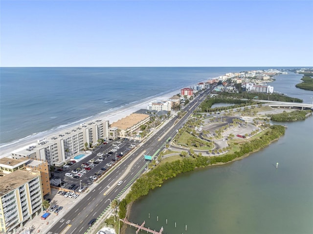 aerial view with a water view and a view of the beach