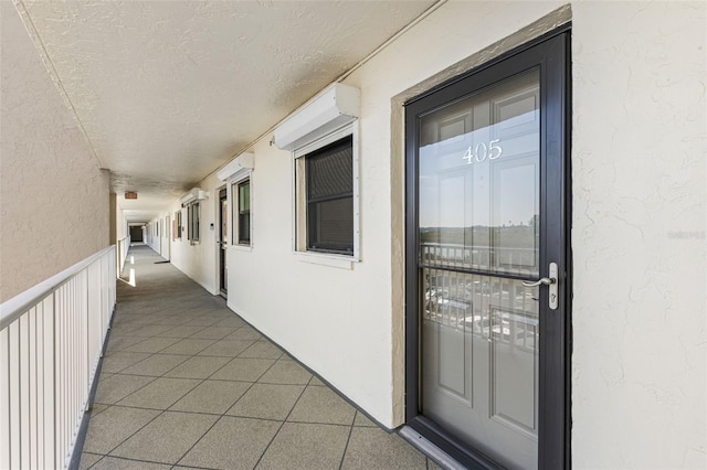 exterior space featuring a wall unit AC