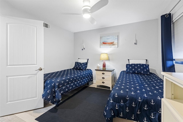 bedroom with hardwood / wood-style floors and ceiling fan