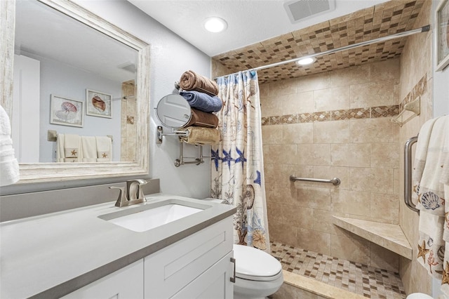 bathroom featuring vanity, a shower with curtain, and toilet