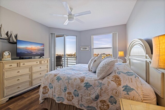 bedroom featuring ceiling fan, access to outside, and dark wood-style flooring