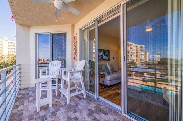 balcony featuring ceiling fan