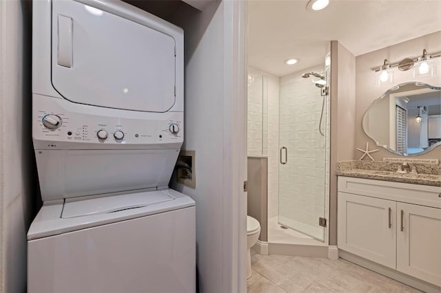 clothes washing area featuring laundry area, stacked washer and clothes dryer, light tile patterned flooring, a sink, and recessed lighting