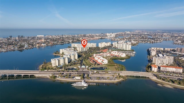 drone / aerial view featuring a view of city and a water view