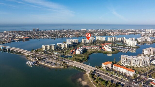 birds eye view of property with a view of city and a water view