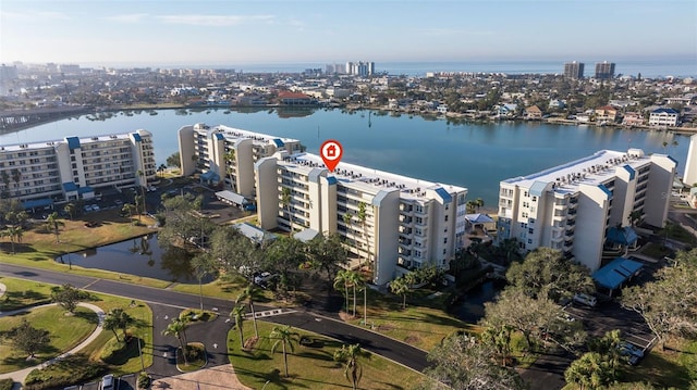 birds eye view of property featuring a view of city and a water view