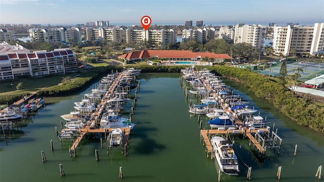 drone / aerial view featuring a water view and a view of city