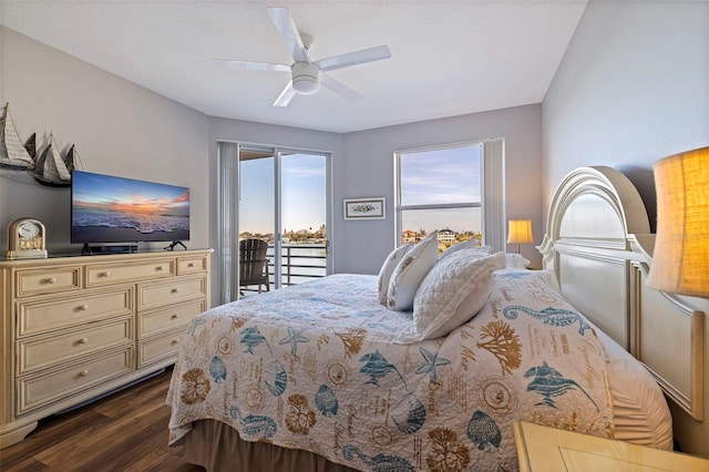 bedroom with dark wood-style flooring, a ceiling fan, and access to exterior