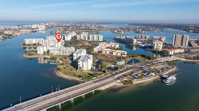birds eye view of property featuring a water view and a city view