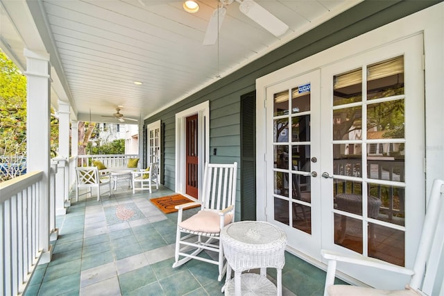 balcony featuring french doors, ceiling fan, and a porch