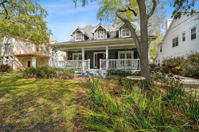 view of front of property featuring a porch and a front lawn