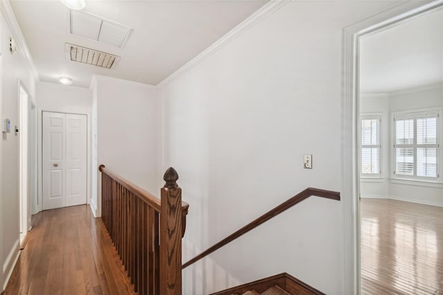 corridor featuring crown molding and hardwood / wood-style floors