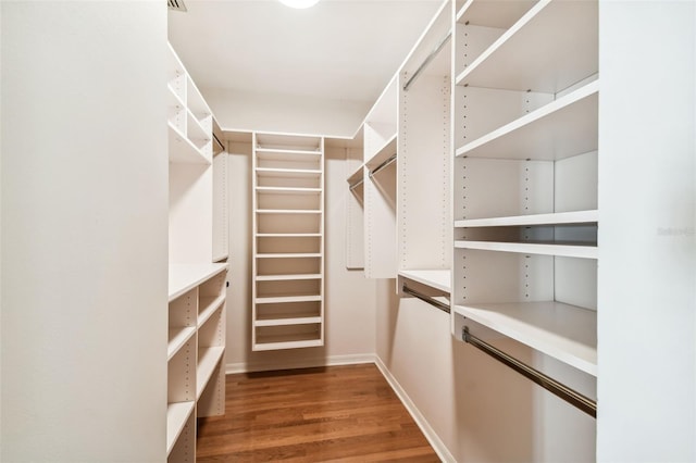 spacious closet featuring hardwood / wood-style floors