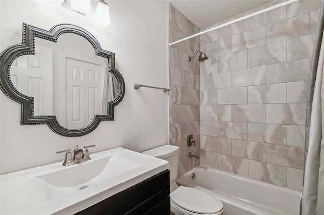 full bathroom featuring shower / bath combo, vanity, and toilet