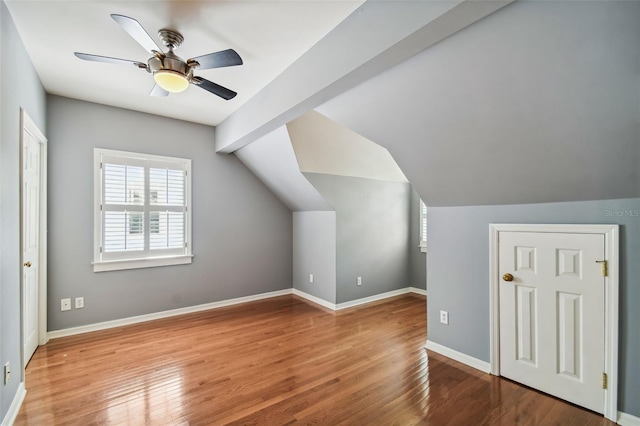 bonus room featuring lofted ceiling, hardwood / wood-style floors, and ceiling fan