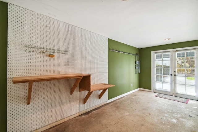 interior space featuring concrete flooring and french doors