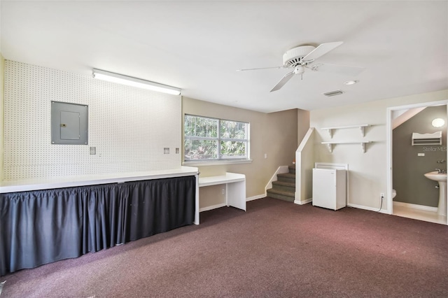 interior space featuring electric panel and ceiling fan